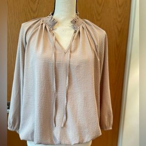 NRFB cream blouse with elastic hem.